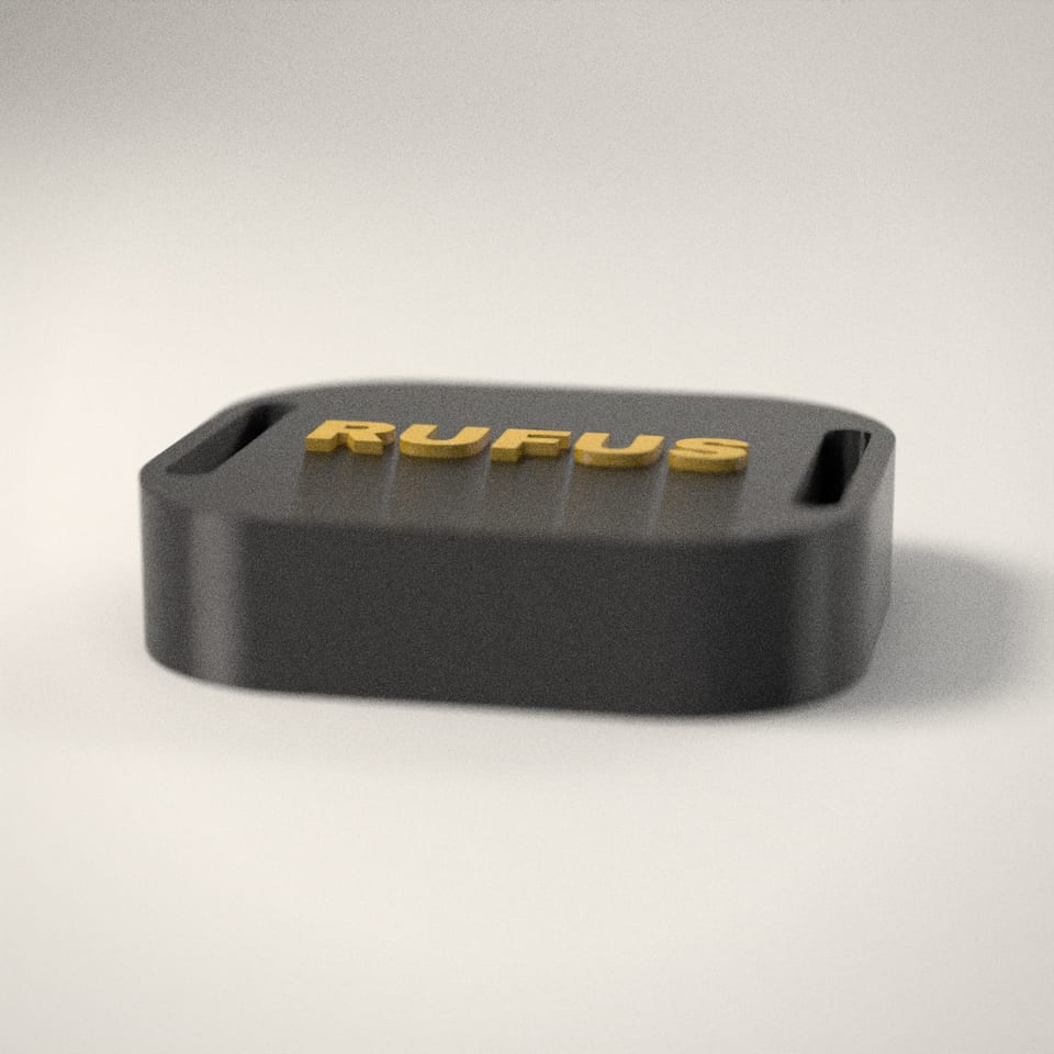 Personalised AirTag Holder for Dog Collars from a low side angle, showing how far the lettering stands up