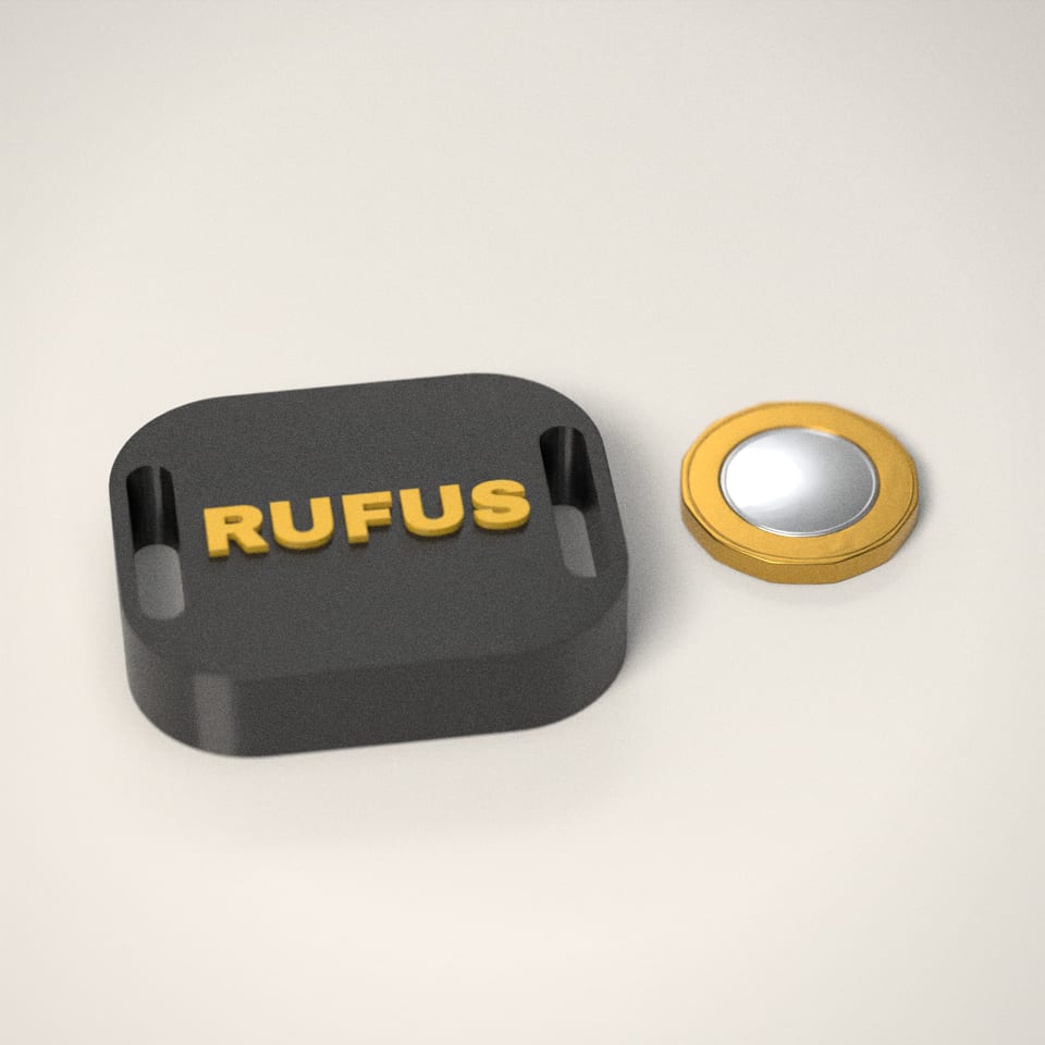 Personalised AirTag Holder for Dog Collars next to a £1-coin-sized disc for scale