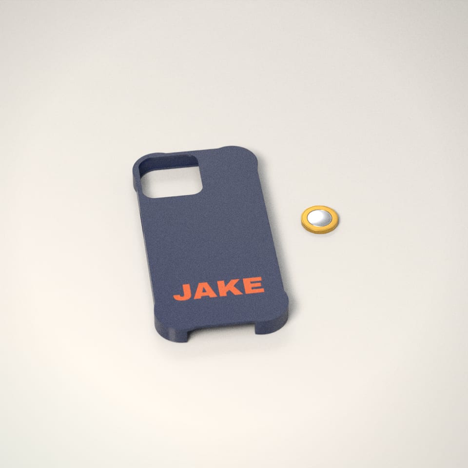 Personalised Bumper Phone Case next to a £1-coin-sized disc for scale