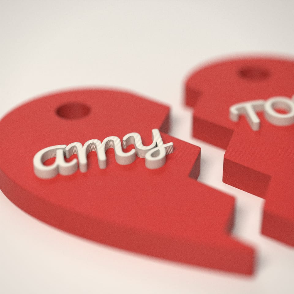 Close-up of the 'AMY' lettering, showing the fine 0.2 mm print layers