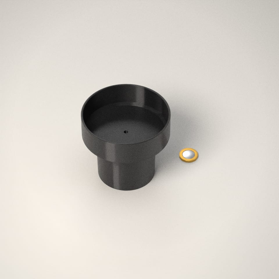 Car Cup Holder Adapter (Made to Fit) next to a £1-coin-sized disc for scale