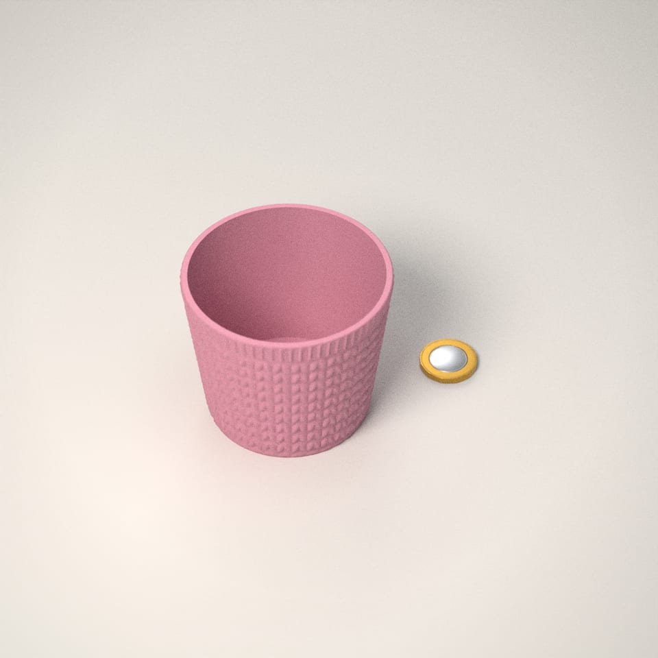 Knitted-Look Plant Pot next to a £1-coin-sized disc for scale