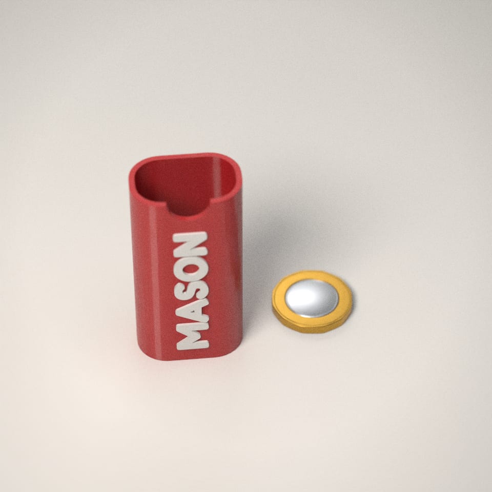 Personalised Lighter Case next to a £1-coin-sized disc for scale