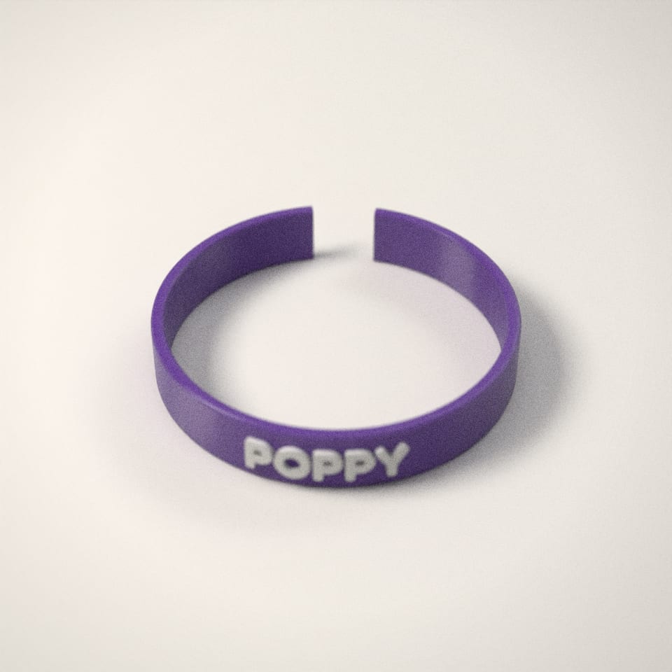 Personalised Name Bangle from a low side angle, showing how far the lettering stands up