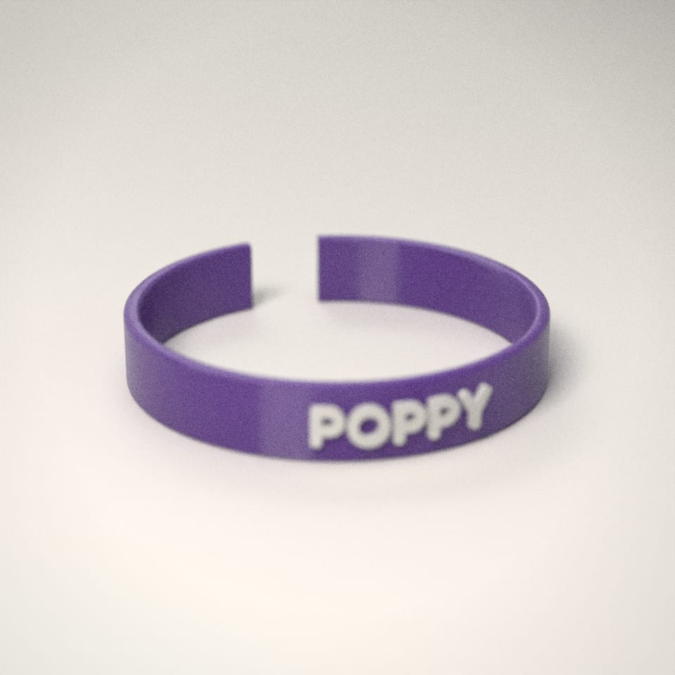Grape personalised Name Bangle reading 'POPPY' in Snow White letters
