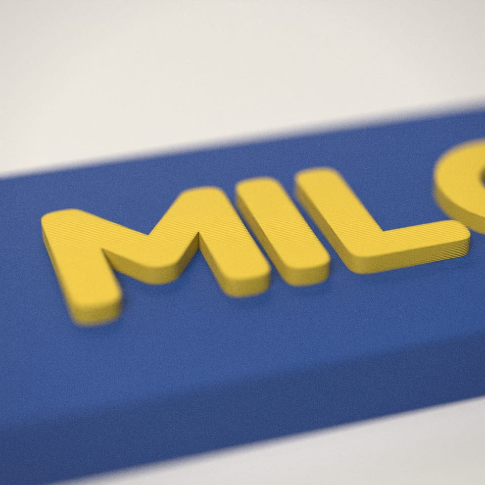 Close-up of the 'MILO' lettering, showing the fine 0.2 mm print layers