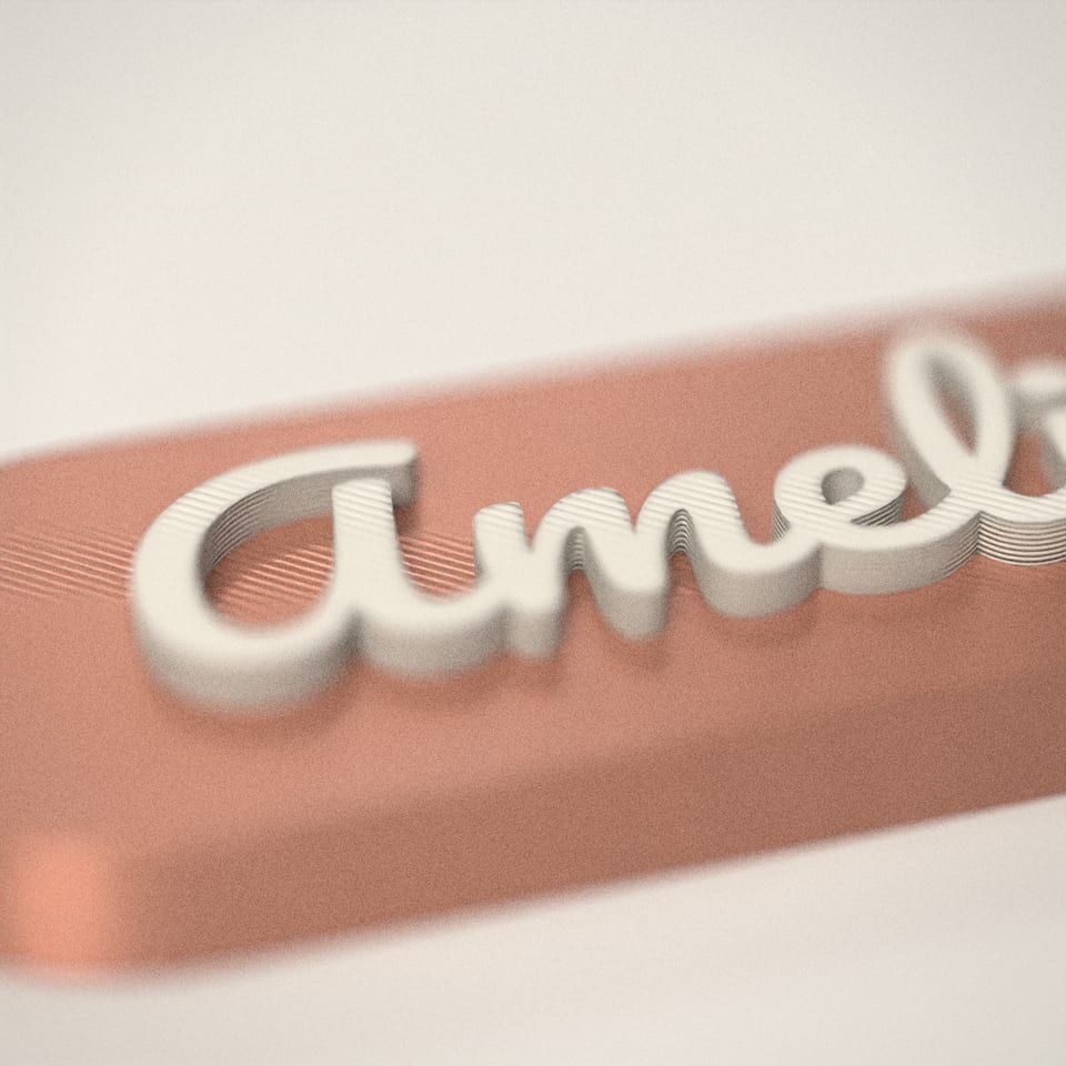 Close-up of the 'Amelia' lettering, showing the fine 0.2 mm print layers