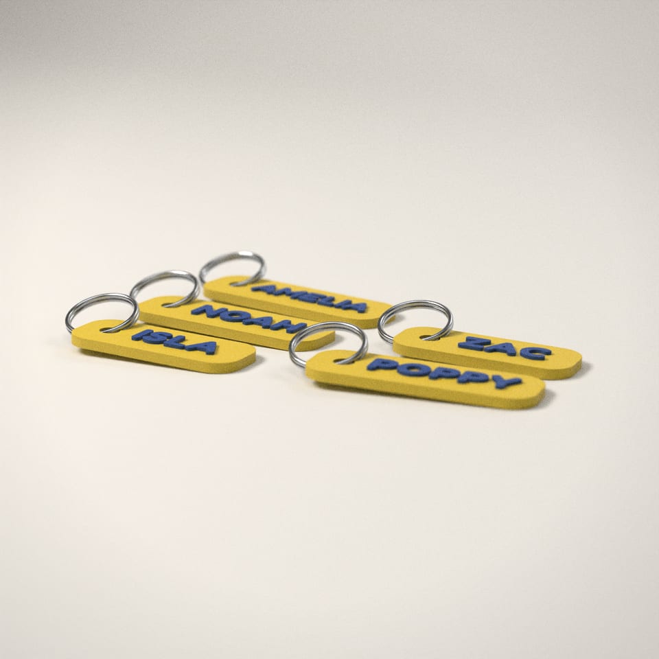 Party Bag Name Keyrings from a low side angle, showing how far the lettering stands up