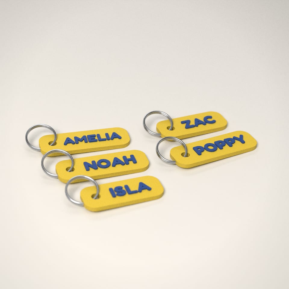 Lemon Yellow Party Bag Name Keyrings reading 'AMELIA' in Marine Blue letters