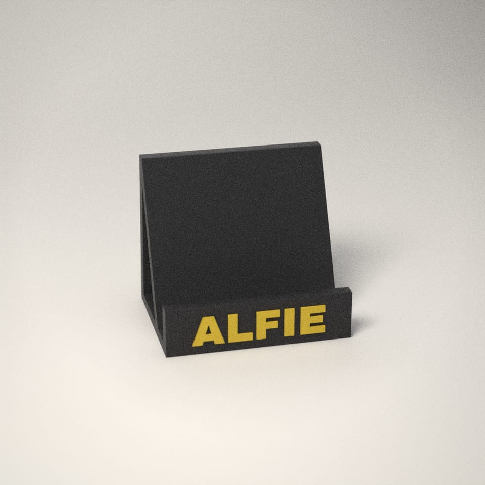 Charcoal personalised Phone Stand reading 'ALFIE' in Lemon Yellow letters