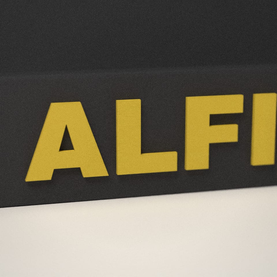 Close-up of the 'ALFIE' lettering, showing the fine 0.2 mm print layers