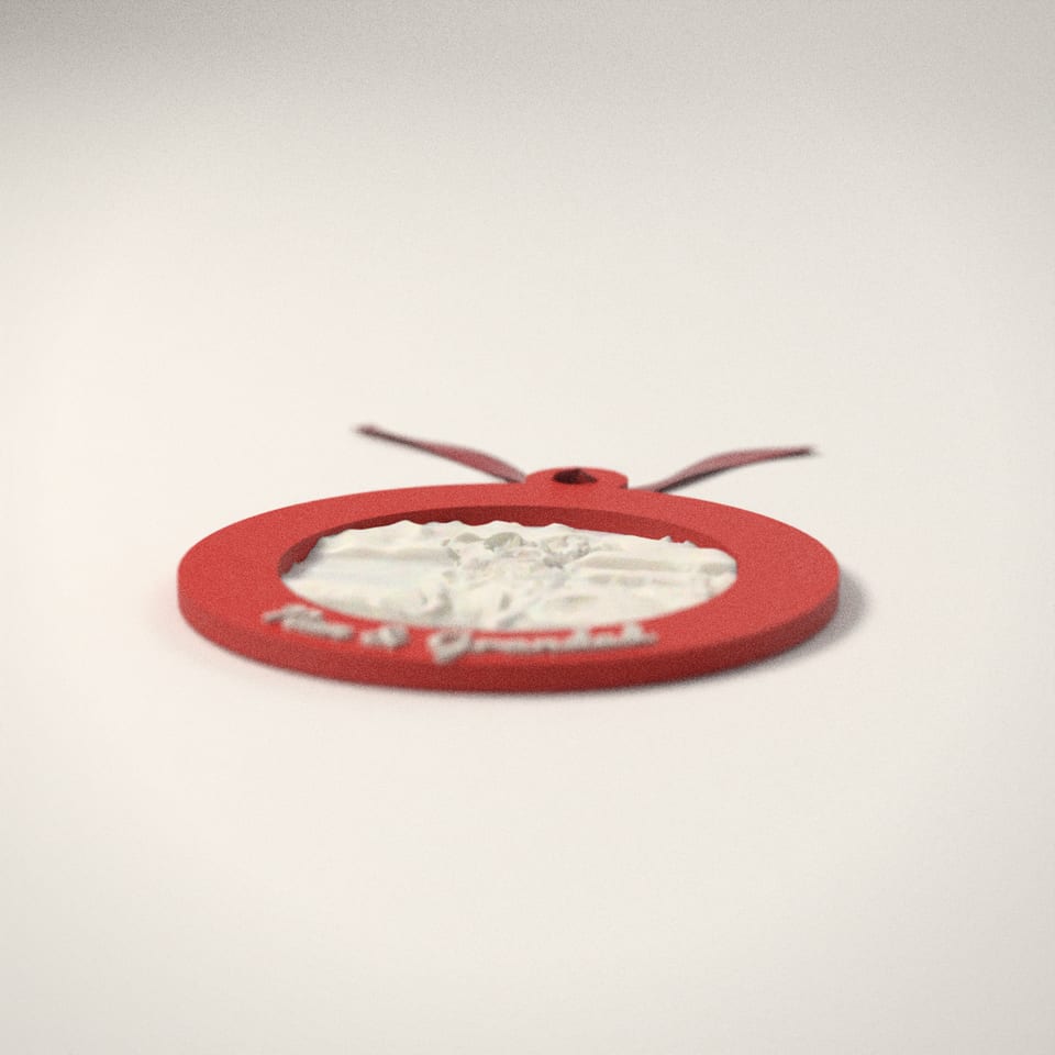 The photo bauble unlit in daylight: the photo shows as a white relief