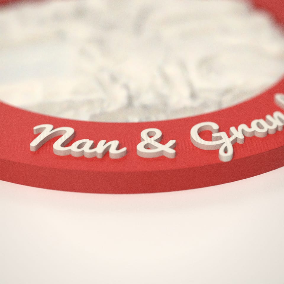 Close-up of the 'Nan & Grandad' lettering, showing the fine 0.2 mm print layers