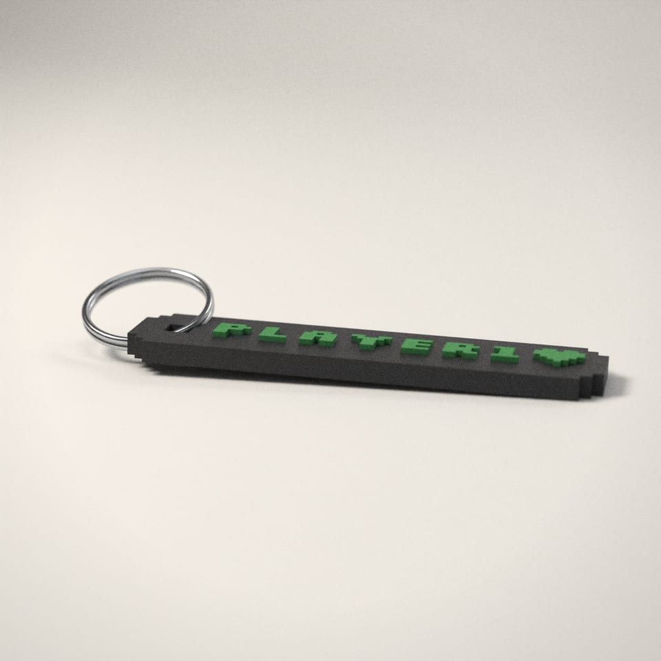Pixel Name Keyring from a low side angle, showing how far the lettering stands up