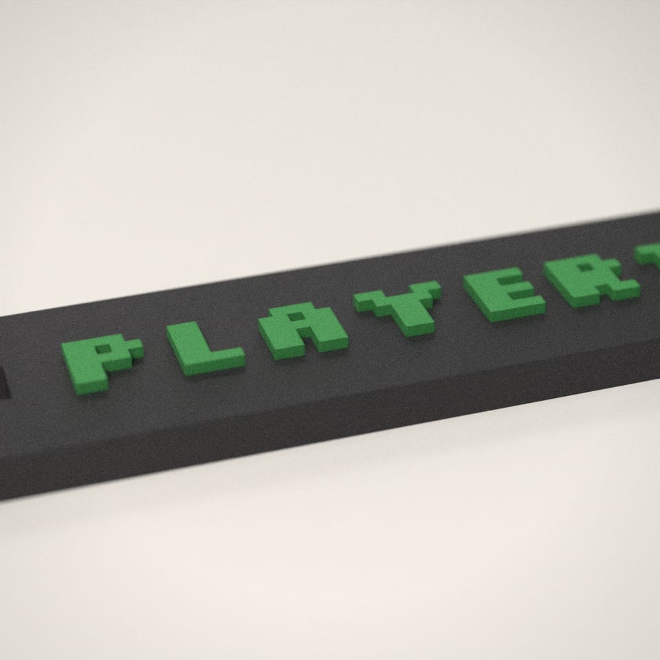 Close-up of the 'PLAYER1' lettering, showing the fine 0.2 mm print layers