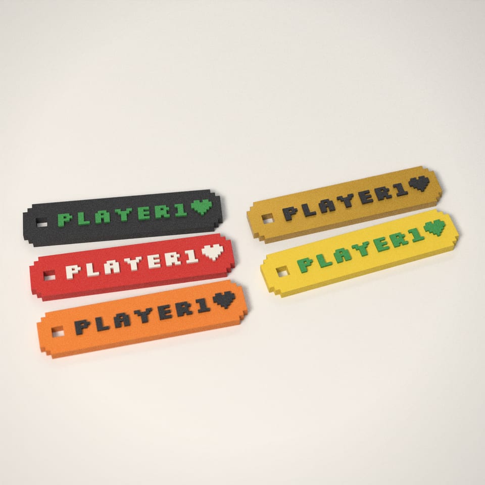 Pixel Name Keyring in 5 colours: Charcoal, Scarlet Red, Mandarin Orange, Silk Gold, Lemon Yellow