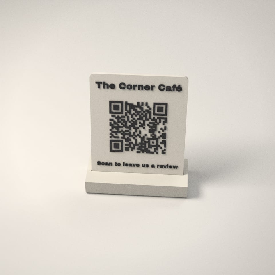 Scan to Review QR Stand from a low side angle, showing how far the lettering stands up