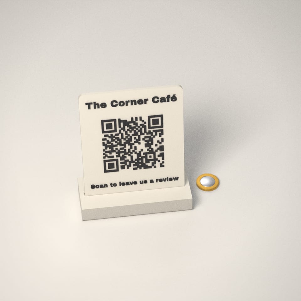 Scan to Review QR Stand next to a £1-coin-sized disc for scale