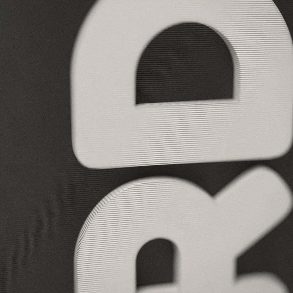 Close-up of the 'JORDAN' lettering, showing the fine 0.2 mm print layers